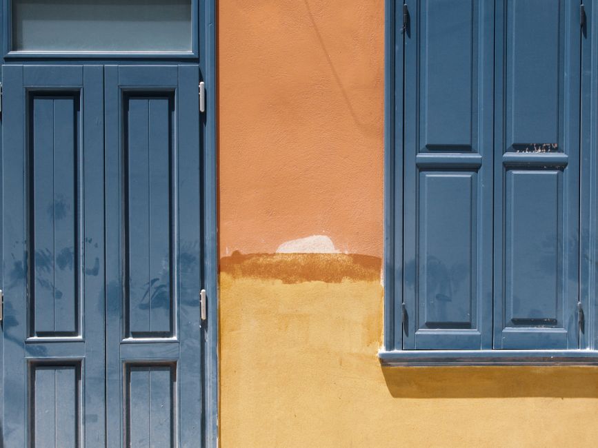 Close view of a painted house wall and window frame
