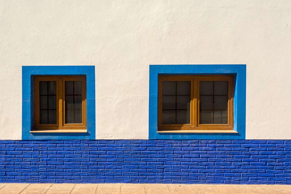 Close view of a painted house wall and window frame
